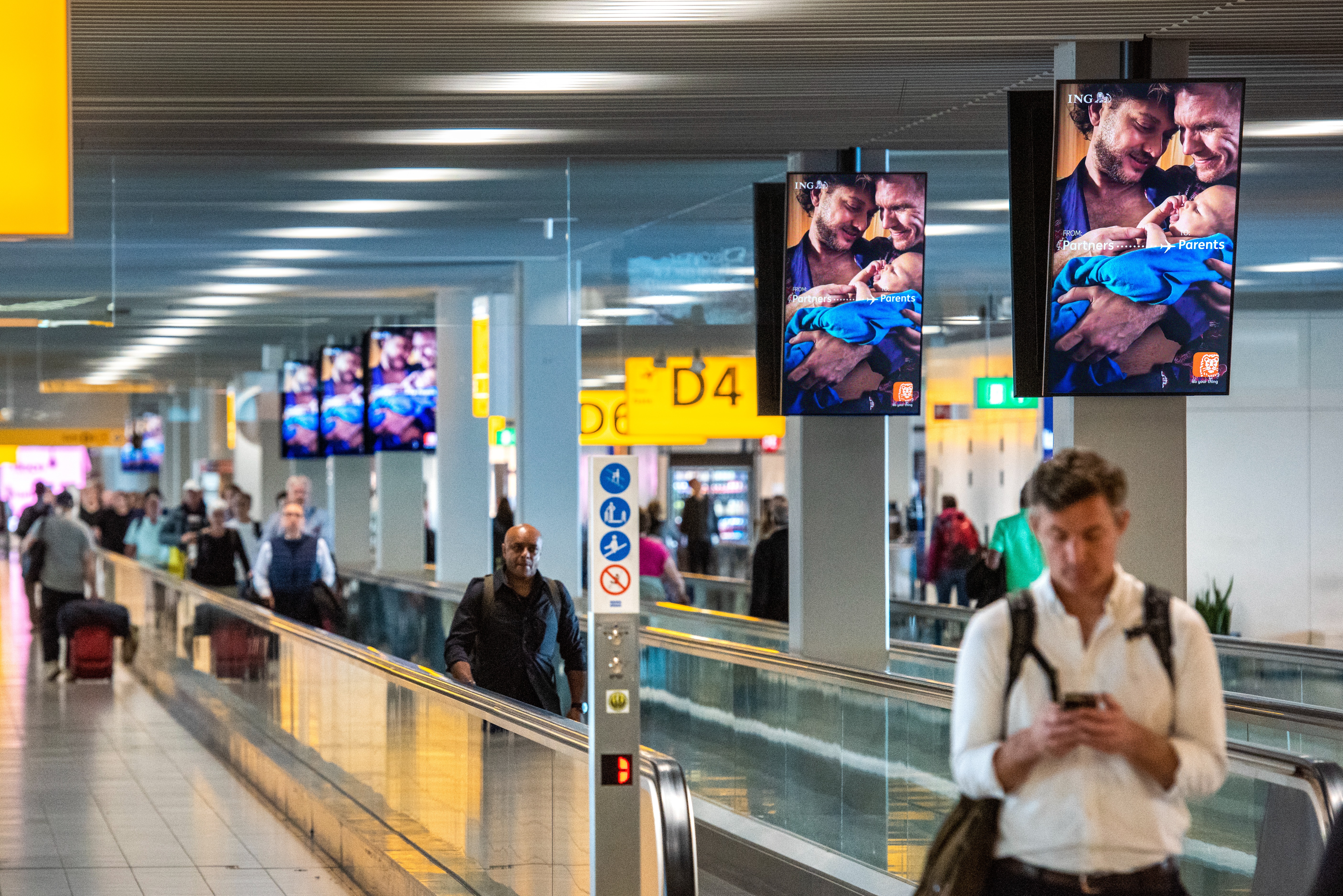 Amsterdam Airport Schiphol, Security checkpoint · suspended LED, real DOOH inventory bookable by the hour on Blindspot