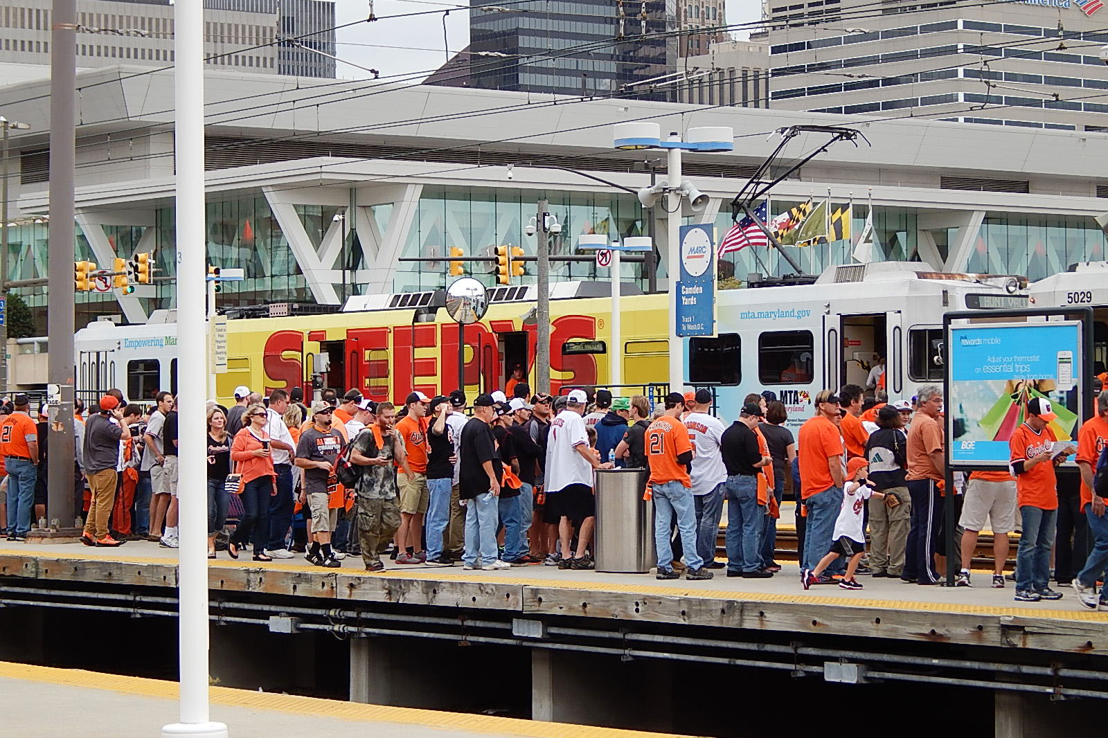 Baltimore, MTA Light RailLink full wrap, Baltimore, real DOOH inventory bookable by the hour on Blindspot