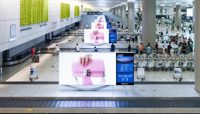 Birmingham Airport, Duty-free walkthrough · premium lightbox, real DOOH inventory bookable by the hour on Blindspot