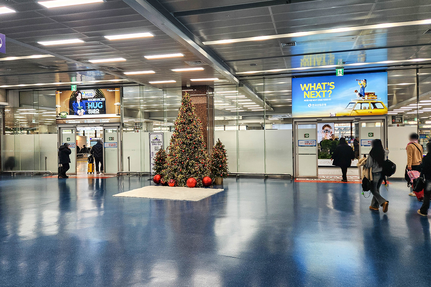 Gimhae International Airport, Departures hall · digital pillar network, real DOOH inventory bookable by the hour on Blindspot