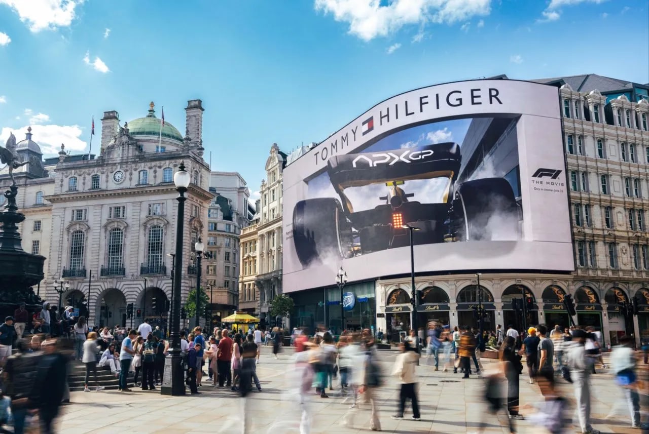 Piccadilly Circus curved digital billboard in central London with dense pedestrian and traffic flow, available programmatically via Blindspot
