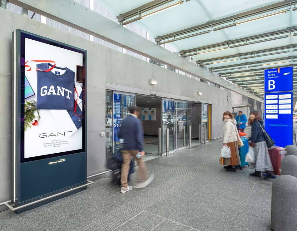 Frankfurt Airport, Gate concourse · holdroom screens, real DOOH inventory bookable by the hour on Blindspot