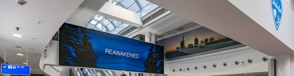 Frankfurt Airport, Duty-free · premium lightbox, real DOOH inventory bookable by the hour on Blindspot