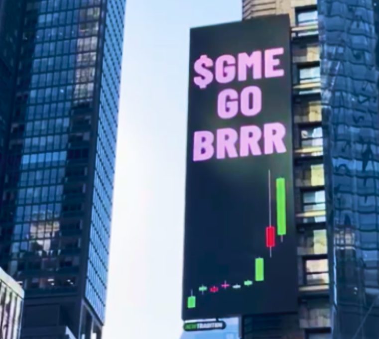 The 'GME go BRRRRR' creative running on a New Tradition digital billboard in Times Square, New York