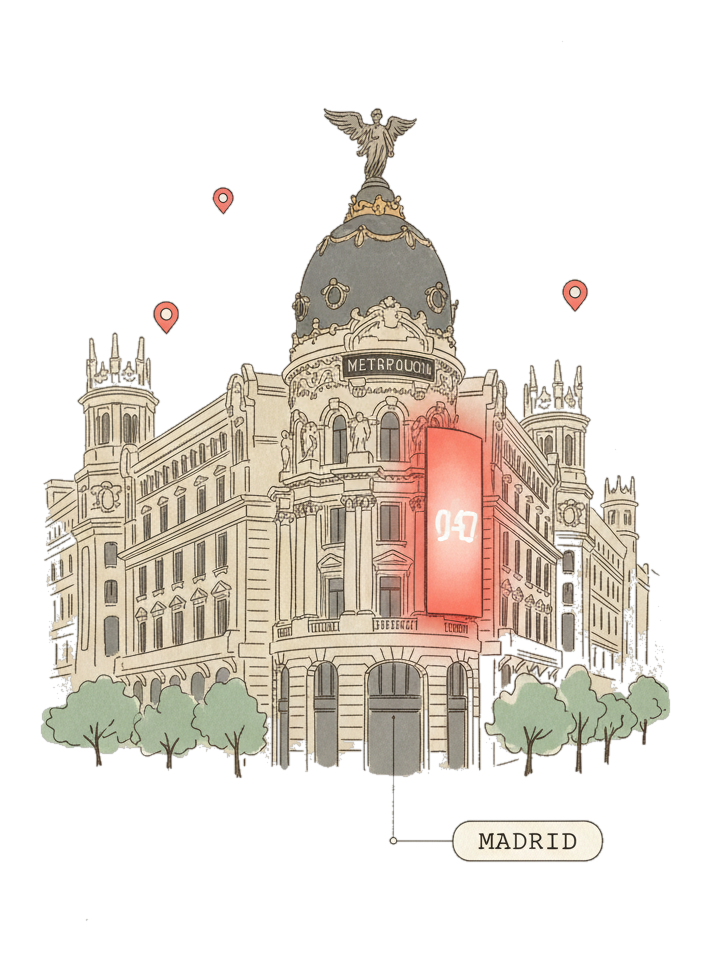 Illustrated Madrid's Metropolis Building on Gran Via with glowing coral Blindspot DOOH advertising screens