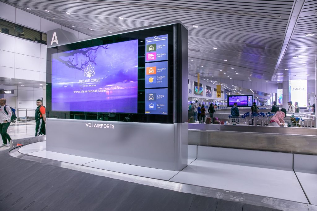 Kuala Lumpur Airport, KLIA digital arrivals baggage-carousel network, real DOOH inventory bookable by the hour on Blindspot