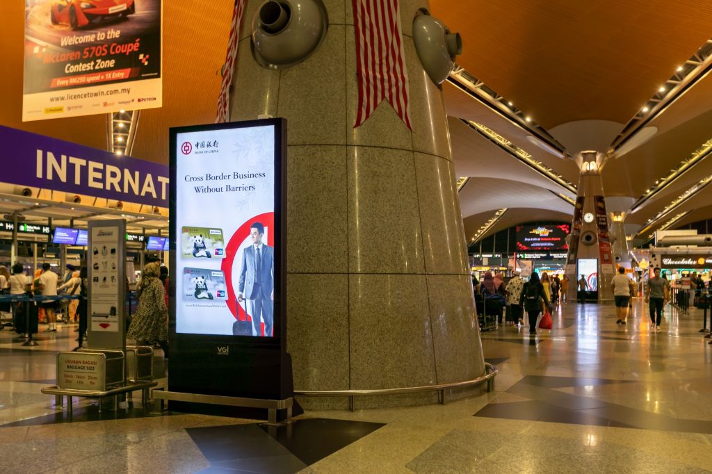 Kuala Lumpur Airport, KLIA digital departures portrait network, real DOOH inventory bookable by the hour on Blindspot