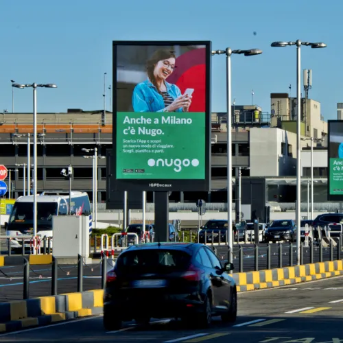 Milan Malpensa Airport, Security checkpoint · suspended LED, real DOOH inventory bookable by the hour on Blindspot