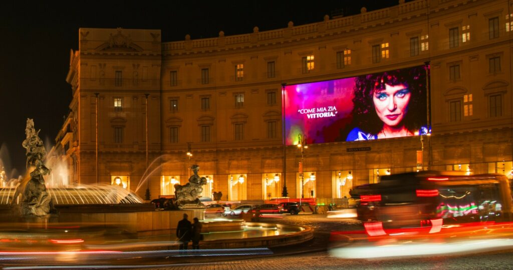 Milan, Maxi facade wrap, real DOOH inventory bookable by the hour on Blindspot