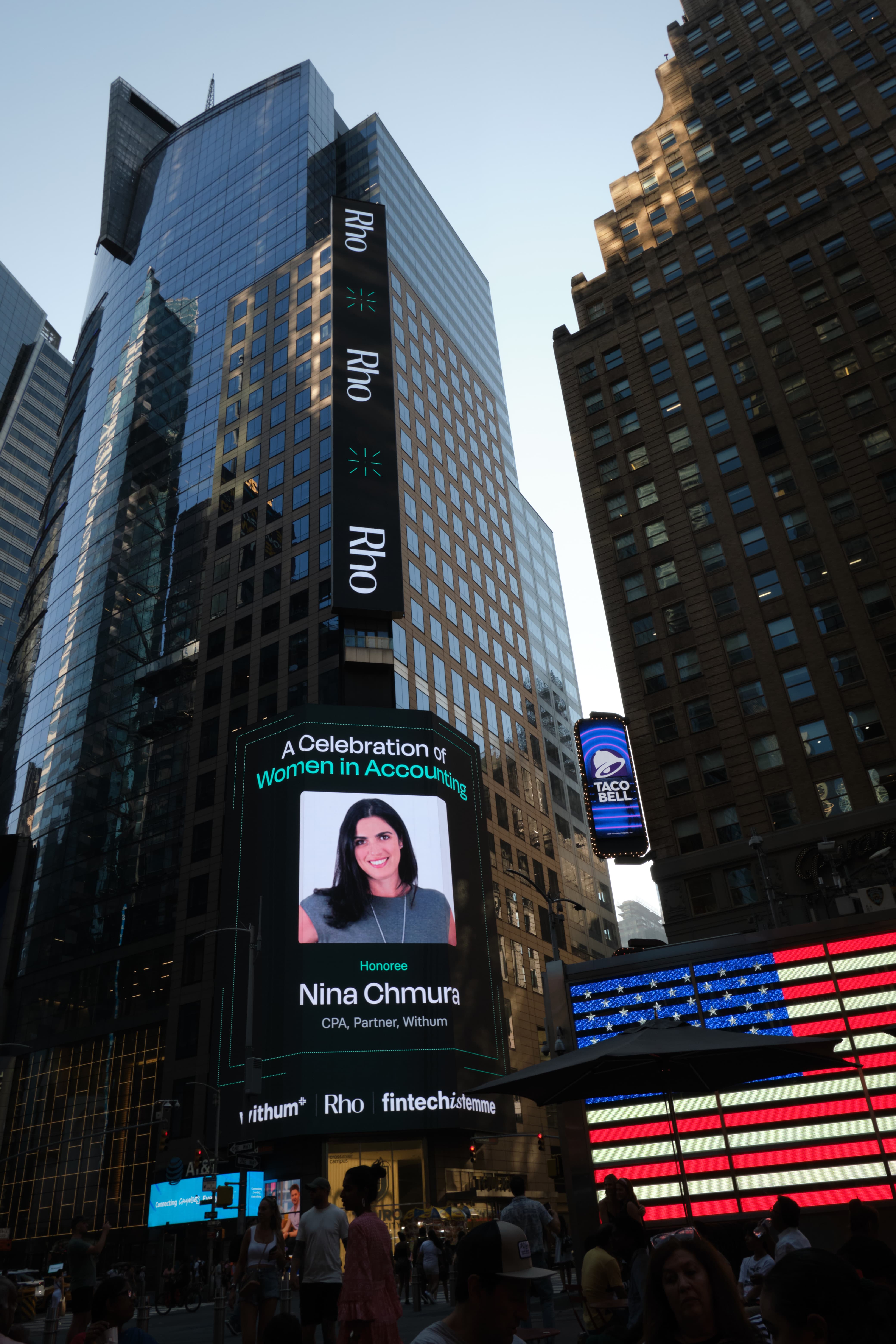 Times Square large-format digital billboard honoring Nina Chmura, CPA Partner at Withum, part of the Celebration of Women in Accounting campaign sponsored by Withum, Rho, and Fintechistemme, in Midtown Manhattan