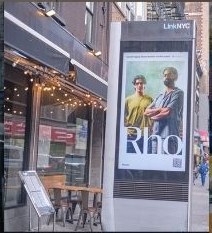 Rho campaign running on a LinkNYC sidewalk kiosk in Manhattan