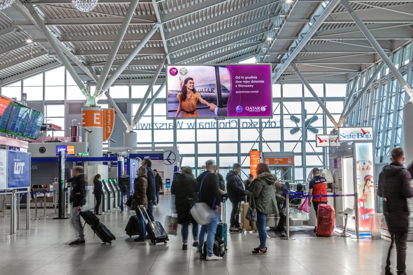 Warsaw Chopin Airport, SKM rail platform · transit LED, real DOOH inventory bookable by the hour on Blindspot