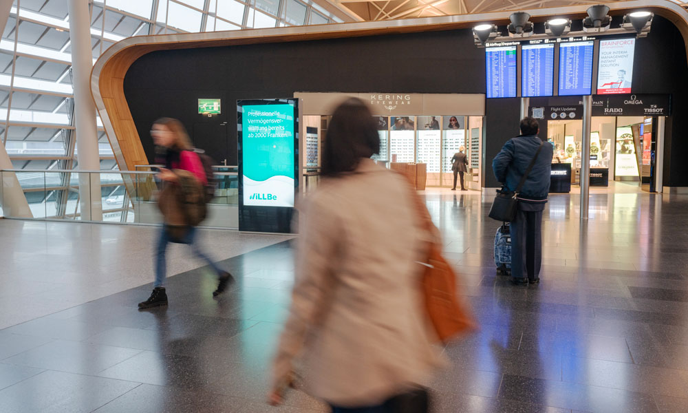 Zurich Airport, Arrivals corridor · animation lightbox, real DOOH inventory bookable by the hour on Blindspot