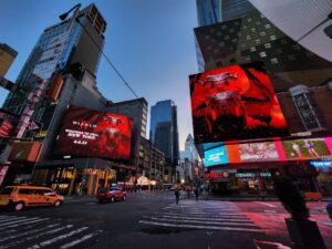 Vibrant Diablo game advertisement prominently displayed on a large billboard in Times Square's iconic setting