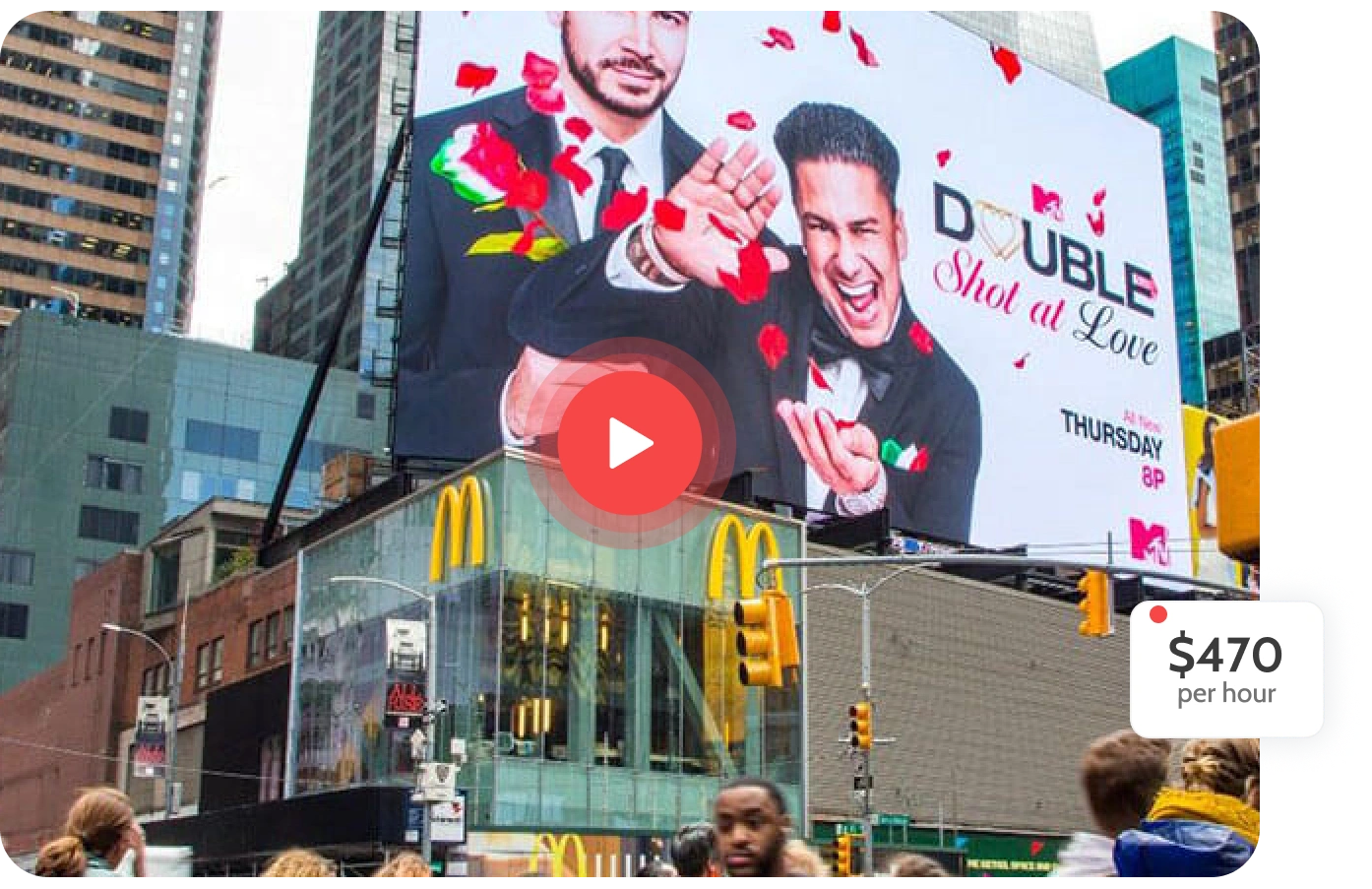 Billboard in Times Square promoting MTV's 'Double Shot at Love' with a play button overlay and a $470 per hour price tag.